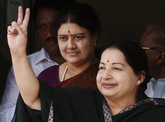Chennai: Tamil Nadu chief minister and AIADMK chief J Jayalalithaa along with her close aide Sasikala Natarajan leaves after filing nomination papers for upcoming state assembly polls, at Tondiarpet zonal office in Chennai on Monday. PTI Photo by R Senthil Kumar (PTI4_25_2016_000077B)