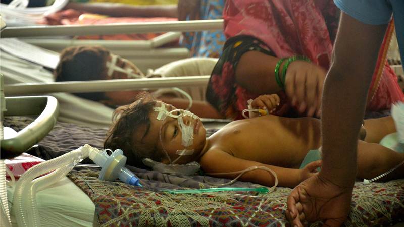 Gorakhpur: Children receive treatments in the Encephalitis  Ward at the Baba Raghav Das Medical College Hospital where over 60 children have died over the past one week, in Gorakhpur district on Monday. PTI Photo  (PTI8_14_2017_000144B)