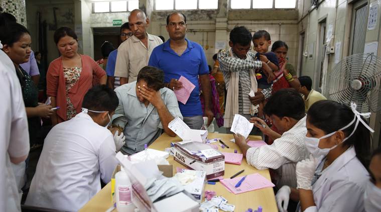 Indians suffering from fever get their blood test for dengue at a fever clinic run by a government hospital in New Delhi, India, Thursday, Sept. 17, 2015. India's capital struggles with its worst outbreak of the dengue fever in five years. Outbreaks of the mosquito-borne disease are reported every year after the monsoon season that runs from June to September. (AP Photo/Manish Swarup)