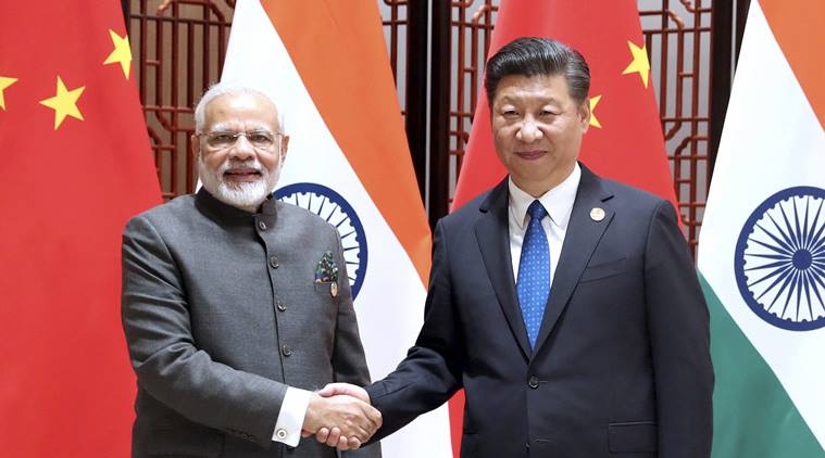 Xiamen : In this photo released by China's Xinhua News Agency, Indian Prime Minister Narendra Modi, left, and China's President Xi Jinping shake hands as they pose for a photo during a meeting on the sidelines of the BRICS Summit in Xiamen in southeastern China's Fujian Province, Tuesday, Sept. 5, 2017. India's foreign secretary says the leaders of China and India have emphasized that peace and tranquility in their border areas is a "prerequisite" for the further development of their relationship.AP/PTI(AP9_5_2017_000058B)