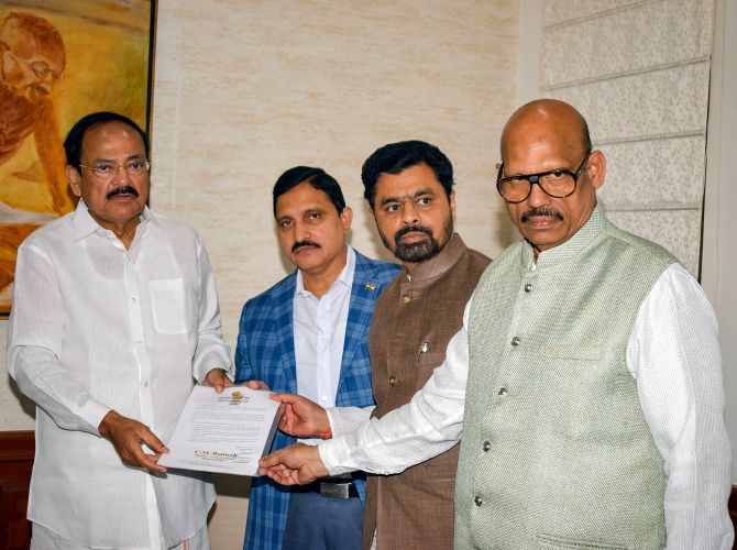 New Delhi: TDP Rajya Sabha MPs Y Sujana Chowdary, TG Venkatesh and CM Ramesh submit their resignation to Rajya Sabha Chairman M Venkaiah Naidu as they resign from the party, in New Delhi, Thursday, June 20, 2019. (PTI Photo) (PTI6_20_2019_000163B)
