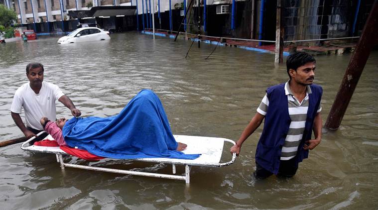 Patna: A patient leaves from Nalanda Medical College and Hospital (NMCH) following waterlogging after heavy monsoon rains in Patna, Saturday, Sept. 28,2019. (PTI Photo)(PTI9_28_2019_000039A)