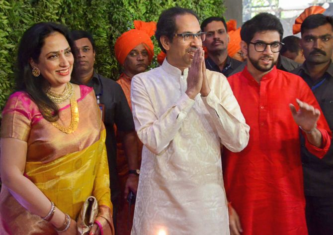 Mumbai: Shiv Sena chief Uddhav Thackeray with wife Rashmi and son Aditya arrive to attend the wedding ceremony of MNS Chief Raj Thackeray's son Amit Thackeray who tied the knot with Mitali Borude, in Mumbai, Sunday, Jan 27, 2019. (PTI Photo) (PTI1_27_2019_000107B)
