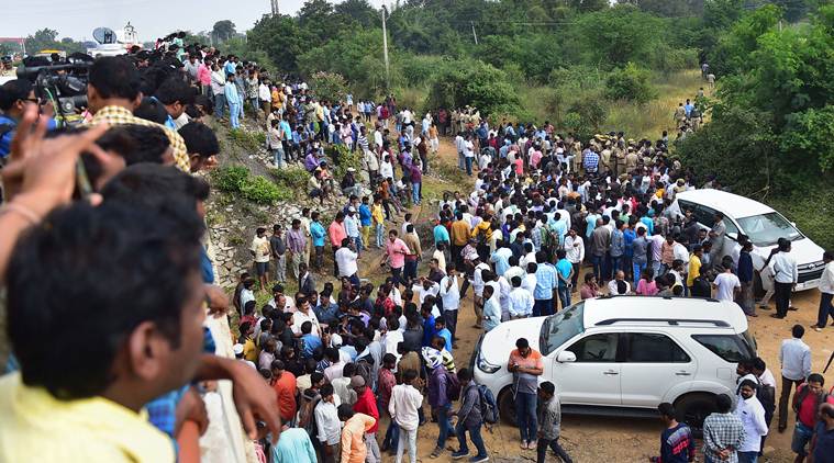 Hyderabad: Onlookers gather near the encounter site, where four accused in the rape-and-murder case of a 25-year-old woman veterinarian were shot dead by police, at Shadnagar of Ranga Reddy district in Hyderabad, Friday, Dec. 6, 2019. (PTI Photo/Shailendra Bhojak)(PTI12_6_2019_000124A)