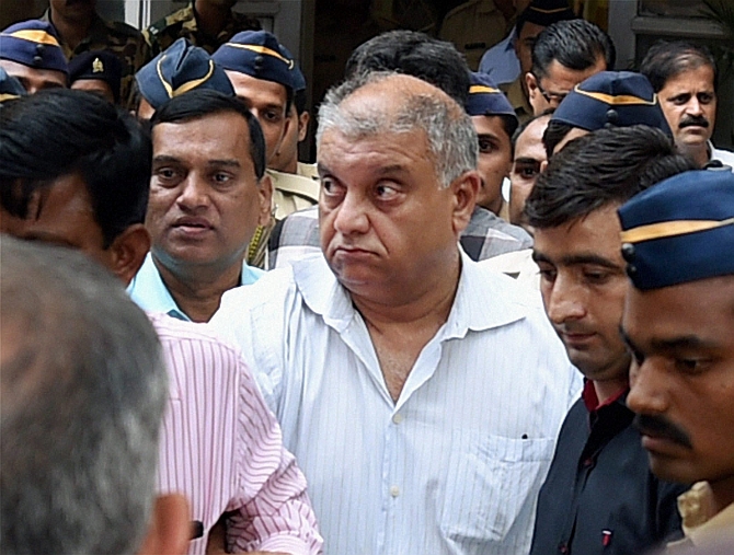 Mumbai: Peter Mukerjea is escorted after being produced by the CBI at the Esplanade court in Mumbai on Friday in connection with Sheena Bora murder case. PTI Photo by Shashank Parade (PTI11_20_2015_000125B)
